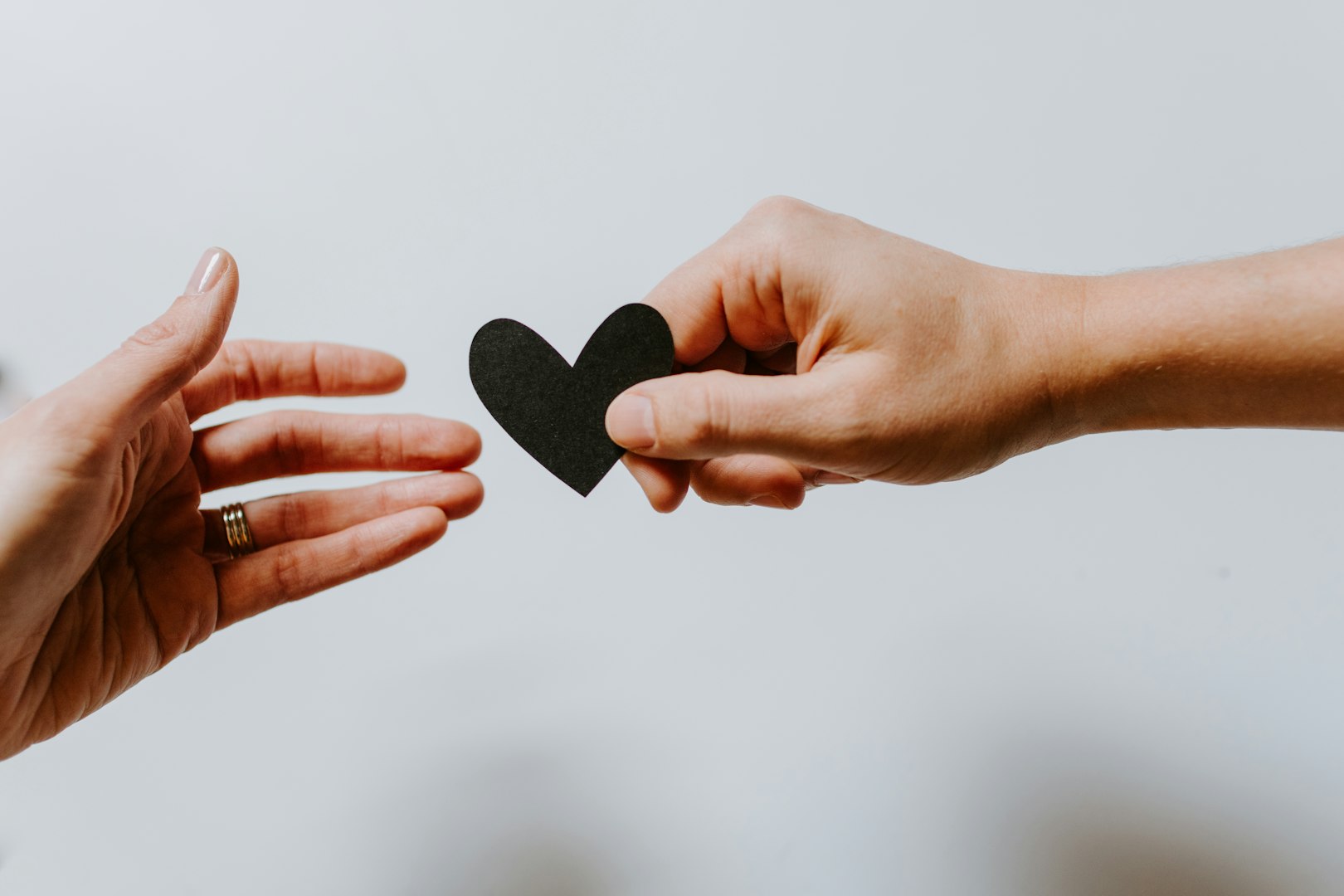 Heartwarming scene of a female therapist and a young client sharing an encouraging high five in a modern, sunlit office. The atmosphere conveys trust, growth, and emotional support, highlighting the value of positive connections and mental health care. Ideal for concepts of therapy, wellbeing, mentorship, counseling, psychological support, and professional guidance.