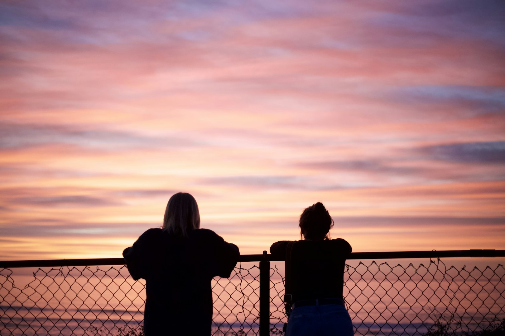 Heartwarming scene of a female therapist and a young client sharing an encouraging high five in a modern, sunlit office. The atmosphere conveys trust, growth, and emotional support, highlighting the value of positive connections and mental health care. Ideal for concepts of therapy, wellbeing, mentorship, counseling, psychological support, and professional guidance.